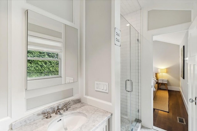 20 Stratton Sq, East Hampton, NY 11937 - full bath with vanity, a shower stall, and wood finished floors