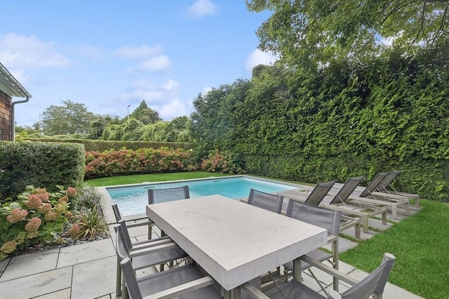 20 Stratton Sq, East Hampton, NY 11937 - view of swimming pool with a fenced backyard, outdoor dining space, and a patio area