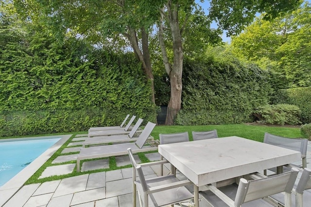 20 Stratton Sq, East Hampton, NY 11937 - view of patio / terrace with an outdoor pool and outdoor dining area
