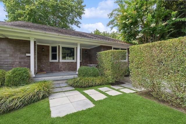 20 Stratton Sq, East Hampton, NY 11937 - view of green lawn featuring covered porch