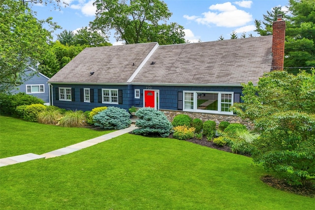 920 Protano Ln, Mamaroneck, NY 10543 - cape cod home with a front yard, roof with shingles, and a chimney