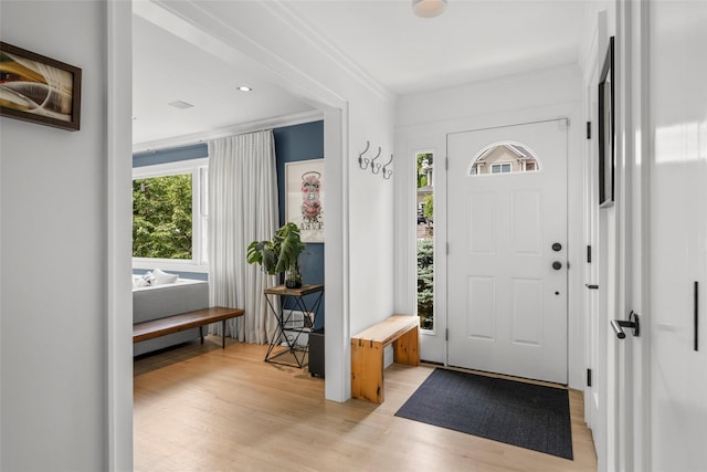920 Protano Ln, Mamaroneck, NY 10543 - foyer with light wood finished floors and ornamental molding