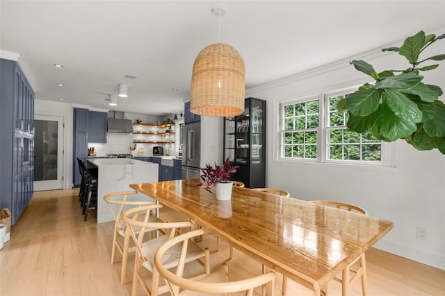 920 Protano Ln, Mamaroneck, NY 10543 - dining room featuring light wood-type flooring, crown molding, and recessed lighting