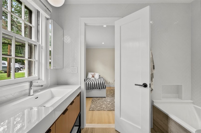 920 Protano Ln, Mamaroneck, NY 10543 - full bathroom with vanity, a tub to relax in, and wood finished floors