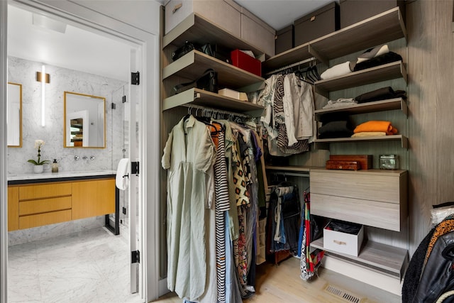 920 Protano Ln, Mamaroneck, NY 10543 - walk in closet with wood finished floors