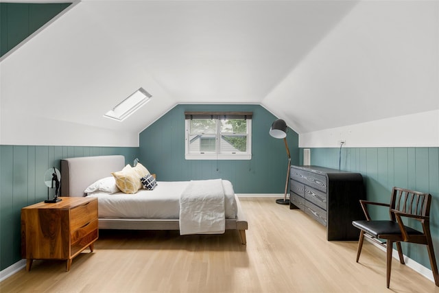 920 Protano Ln, Mamaroneck, NY 10543 - bedroom with wood finished floors, a skylight, lofted ceiling, and wooden walls
