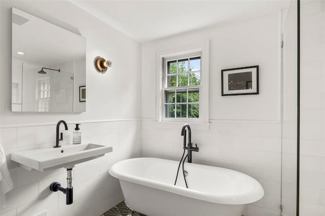 920 Protano Ln, Mamaroneck, NY 10543 - full bathroom featuring a freestanding tub, tile walls, and a wainscoted wall