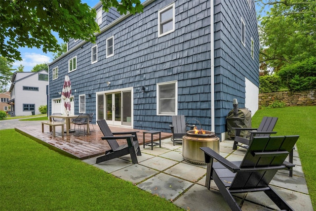 920 Protano Ln, Mamaroneck, NY 10543 - rear view of property featuring an outdoor fire pit, a lawn, and a patio
