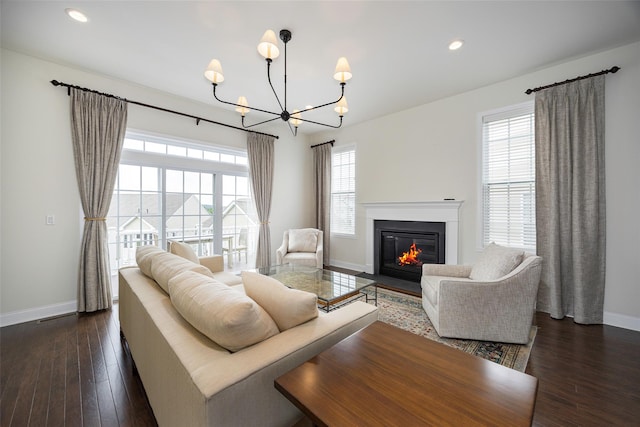 44 Linwood Dr, Wappingers Falls, NY 12590 - living room with a chandelier, a fireplace with flush hearth, dark wood-style floors, and recessed lighting