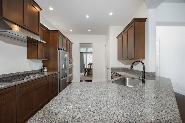 44 Linwood Dr, Wappingers Falls, NY 12590 - kitchen featuring appliances with stainless steel finishes, under cabinet range hood, light stone counters, recessed lighting, and a peninsula