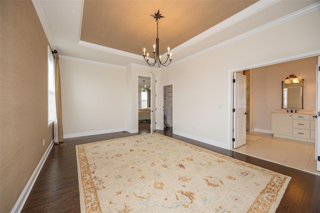 44 Linwood Dr, Wappingers Falls, NY 12590 - unfurnished bedroom with a raised ceiling, a chandelier, dark wood finished floors, crown molding, and ensuite bathroom