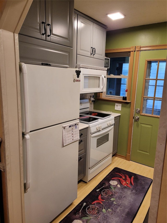 25 Herman Ave, North Babylon, NY 11703 - kitchen with white appliances and light wood-type flooring