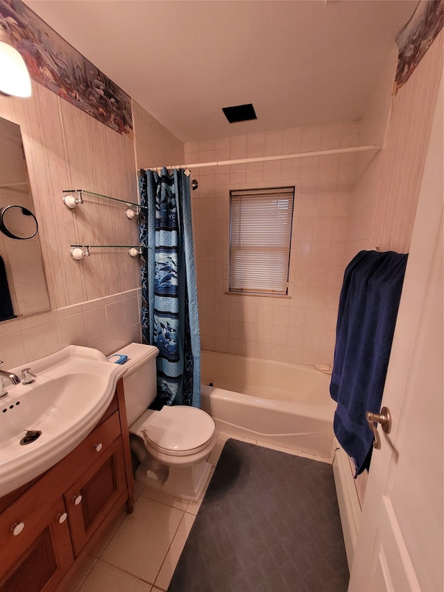 25 Herman Ave, North Babylon, NY 11703 - full bathroom featuring vanity, tile patterned flooring, shower / tub combo with curtain, tile walls, and decorative backsplash