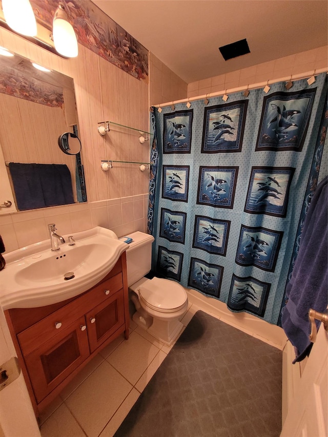 25 Herman Ave, North Babylon, NY 11703 - bathroom featuring vanity, a shower with shower curtain, tile walls, and tile patterned floors