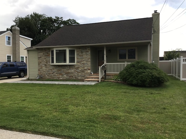 25 Herman Ave, North Babylon, NY 11703 - view of front of house featuring a chimney, covered porch, stone siding, and roof with shingles