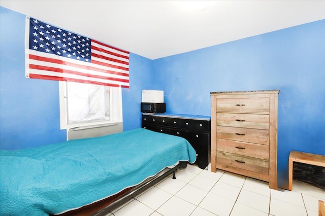 35-44 104th St, Corona, NY 11368 - bedroom featuring light tile patterned flooring