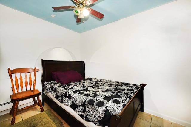35-44 104th St, Corona, NY 11368 - tiled bedroom featuring a ceiling fan and baseboards