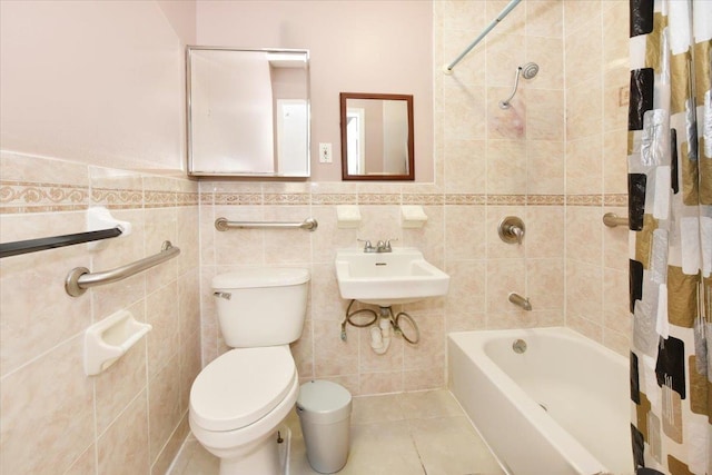 35-44 104th St, Corona, NY 11368 - bathroom with shower / bath combination with curtain, tile walls, wainscoting, and tile patterned floors
