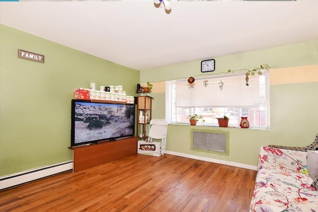 35-44 104th St, Corona, NY 11368 - living area with a baseboard radiator and wood finished floors