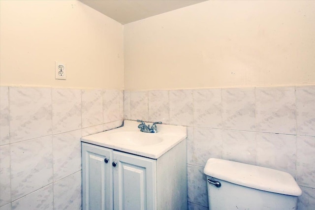 35-44 104th St, Corona, NY 11368 - bathroom with tile walls, vanity, and wainscoting