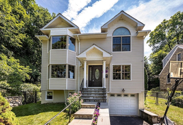 84 Macarthur Ln, Tarrytown, NY 10591 - view of front of property with a garage and asphalt driveway