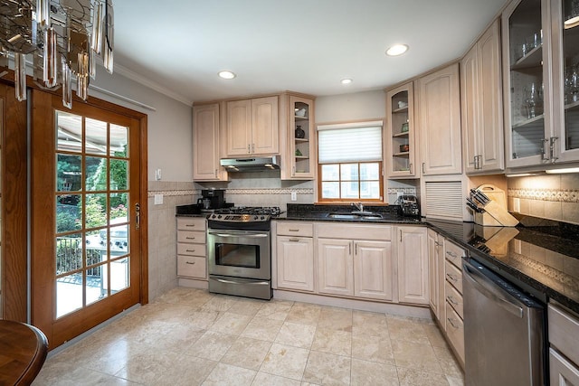 84 Macarthur Ln, Tarrytown, NY 10591 - kitchen with appliances with stainless steel finishes, under cabinet range hood, crown molding, glass insert cabinets, and recessed lighting