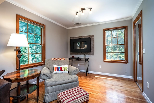 84 Macarthur Ln, Tarrytown, NY 10591 - sitting room with light wood-style flooring and crown molding