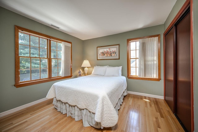 84 Macarthur Ln, Tarrytown, NY 10591 - bedroom featuring light wood finished floors and a closet