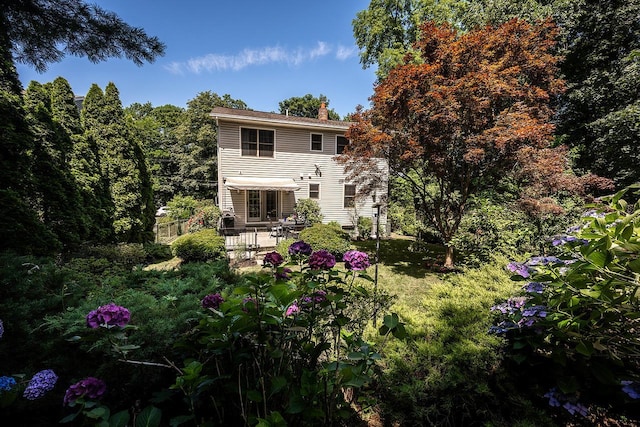 84 Macarthur Ln, Tarrytown, NY 10591 - back of property with a patio and a chimney