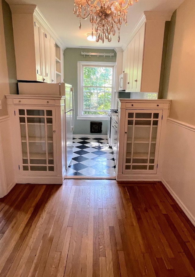 85 N Broadway Unit 2H, White Plains, NY 10603 - unfurnished living room featuring a chandelier and dark wood-style flooring