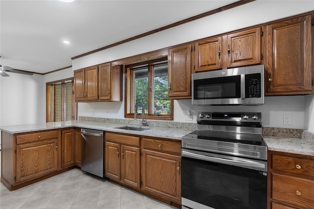 920 Mount Vernon Rd, Wurtsboro, NY 12790 - kitchen with stainless steel appliances, ornamental molding, light tile patterned floors, a peninsula, and brown cabinetry