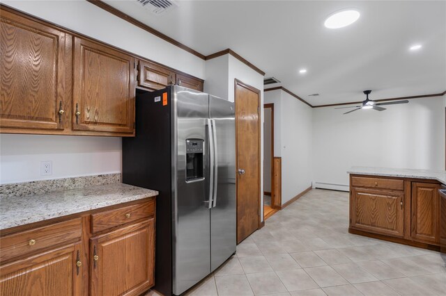 920 Mount Vernon Rd, Wurtsboro, NY 12790 - kitchen featuring stainless steel fridge, crown molding, a ceiling fan, baseboard heating, and brown cabinets