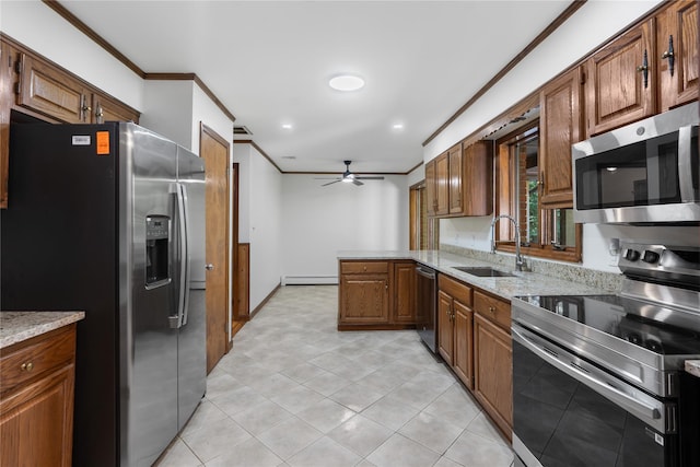 920 Mount Vernon Rd, Wurtsboro, NY 12790 - kitchen with appliances with stainless steel finishes, crown molding, a ceiling fan, a baseboard heating unit, and light stone counters