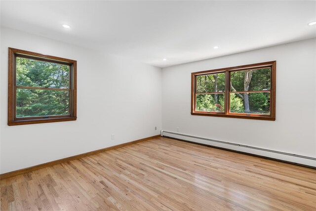 920 Mount Vernon Rd, Wurtsboro, NY 12790 - empty room with light wood-style flooring, a baseboard radiator, and recessed lighting