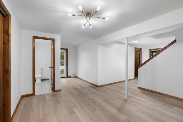 920 Mount Vernon Rd, Wurtsboro, NY 12790 - below grade area featuring light wood-style flooring, a chandelier, and a baseboard radiator