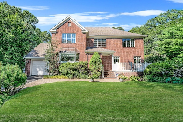 7 Hunter Ct, Dix Hills, NY 11746 - view of front of home with a front yard, driveway, brick siding, an attached garage, and a shingled roof