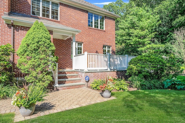 7 Hunter Ct, Dix Hills, NY 11746 - rear view of house with a lawn and brick siding