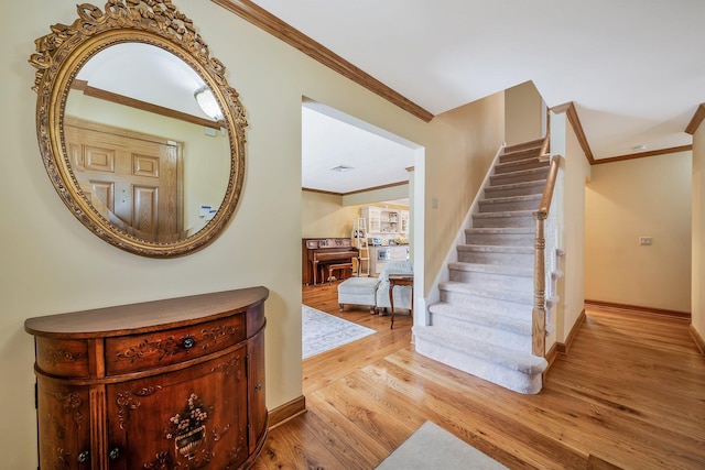 7 Hunter Ct, Dix Hills, NY 11746 - stairs with crown molding and wood finished floors