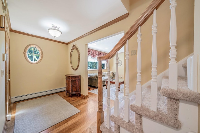 7 Hunter Ct, Dix Hills, NY 11746 - foyer entrance with a baseboard radiator, light wood-style floors, crown molding, and stairway