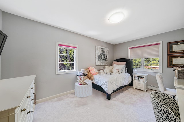 7 Hunter Ct, Dix Hills, NY 11746 - bedroom with multiple windows, light carpet, and a baseboard heating unit