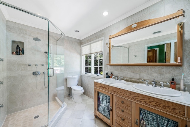 7 Hunter Ct, Dix Hills, NY 11746 - bathroom featuring a shower stall, double vanity, tile patterned floors, tile walls, and ornamental molding