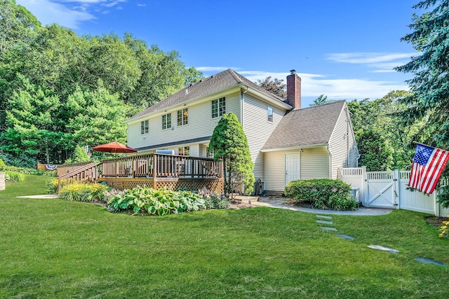 7 Hunter Ct, Dix Hills, NY 11746 - back of property featuring a gate, a deck, a chimney, and a shingled roof