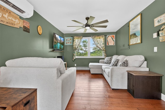 54 Graby Rd, Callicoon, NY 12723 - living room with an AC wall unit, a ceiling fan, hardwood / wood-style flooring, and baseboard heating