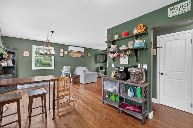 54 Graby Rd, Callicoon, NY 12723 - dining area with a wall mounted air conditioner and wood finished floors