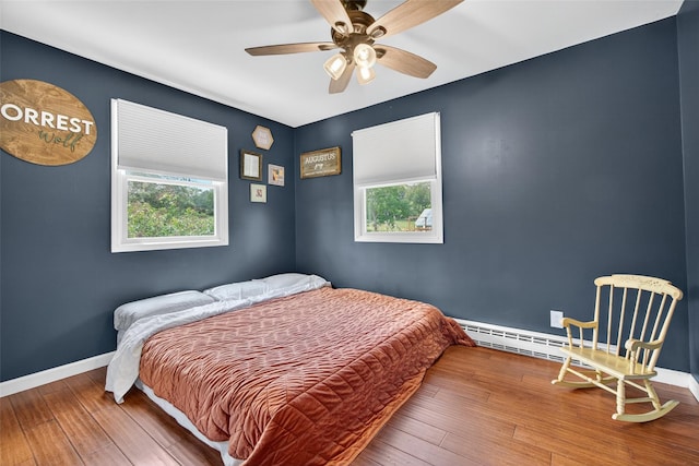 54 Graby Rd, Callicoon, NY 12723 - bedroom with multiple windows, wood-type flooring, and a ceiling fan