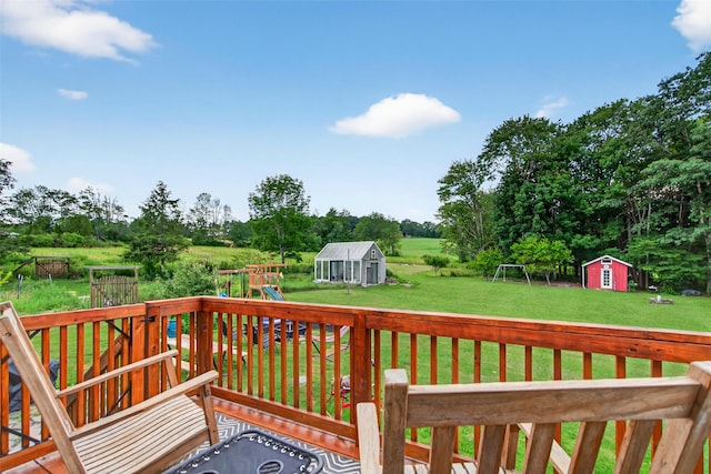 54 Graby Rd, Callicoon, NY 12723 - deck featuring a shed, a playground, a lawn, and view of scattered trees