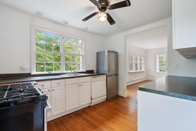 1459 N Country Rd, Wading River, NY 11792 - kitchen featuring white dishwasher, black gas range, dark countertops, and light wood finished floors