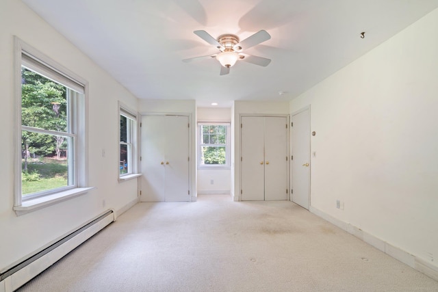 1459 N Country Rd, Wading River, NY 11792 - empty room featuring baseboard heating, ceiling fan, and light carpet