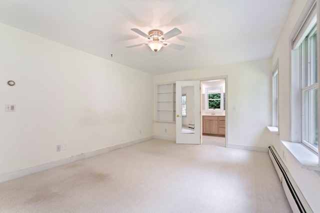 1459 N Country Rd, Wading River, NY 11792 - spare room with a baseboard radiator, plenty of natural light, and ceiling fan