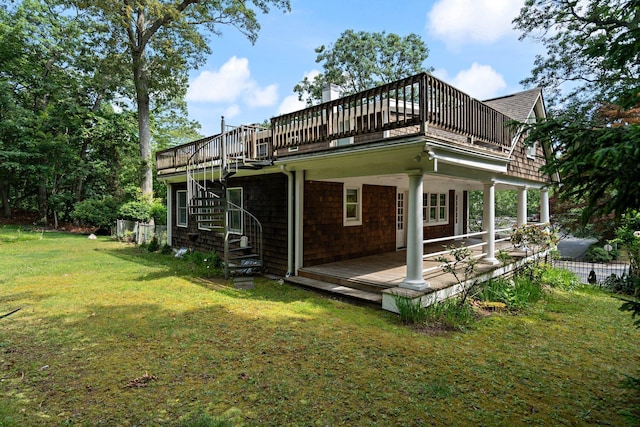 1459 N Country Rd, Wading River, NY 11792 - rear view of property with a yard, a wooden deck, and stairway